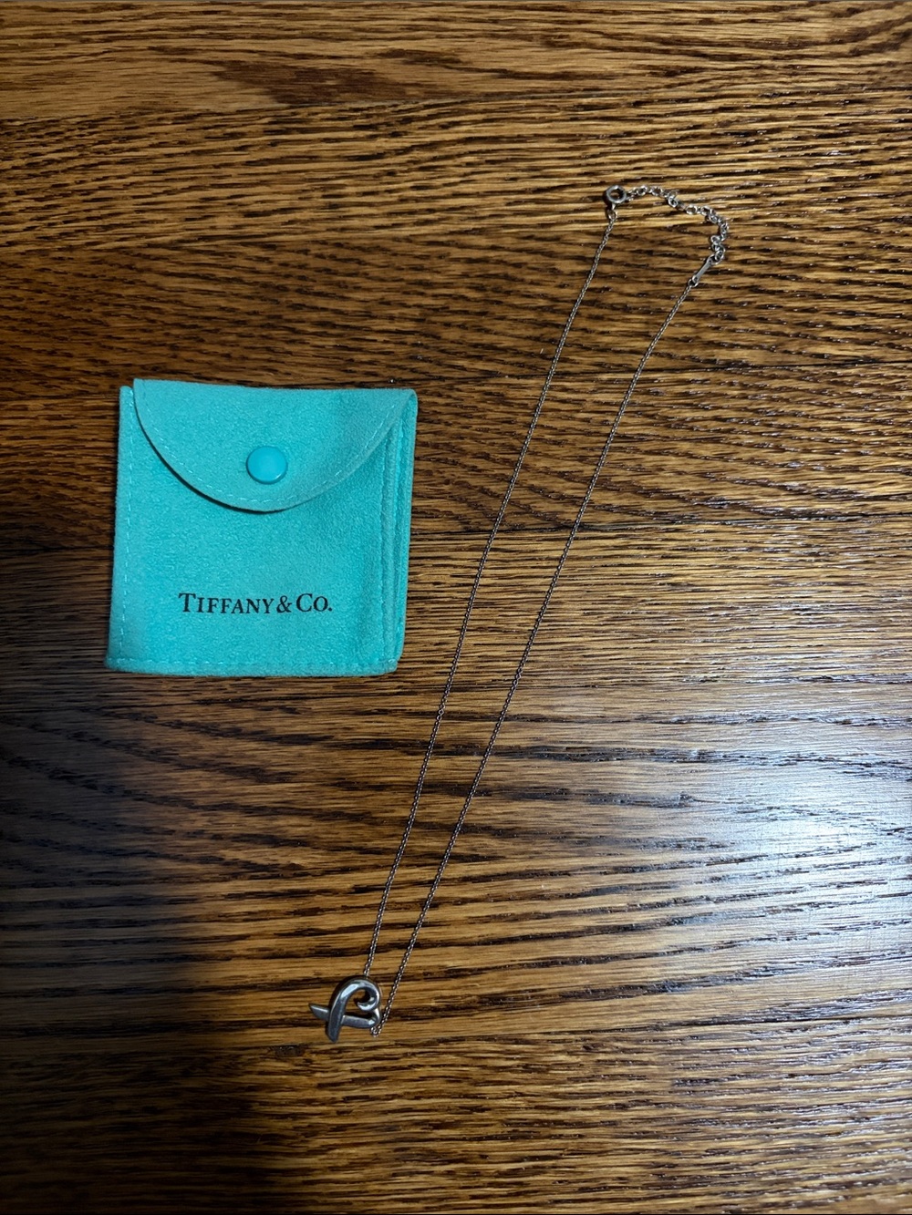 Tiffany & Co. Silver Ribbon Heart Necklace with Blue Pouch